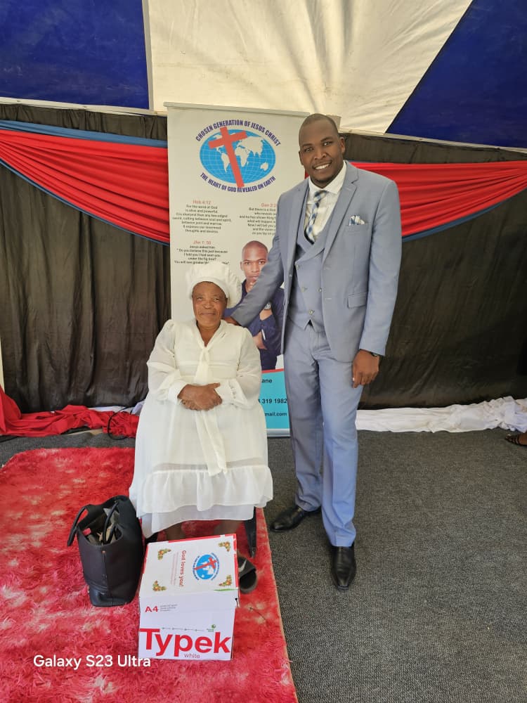 A joyful recipient posing with Prophet Promise